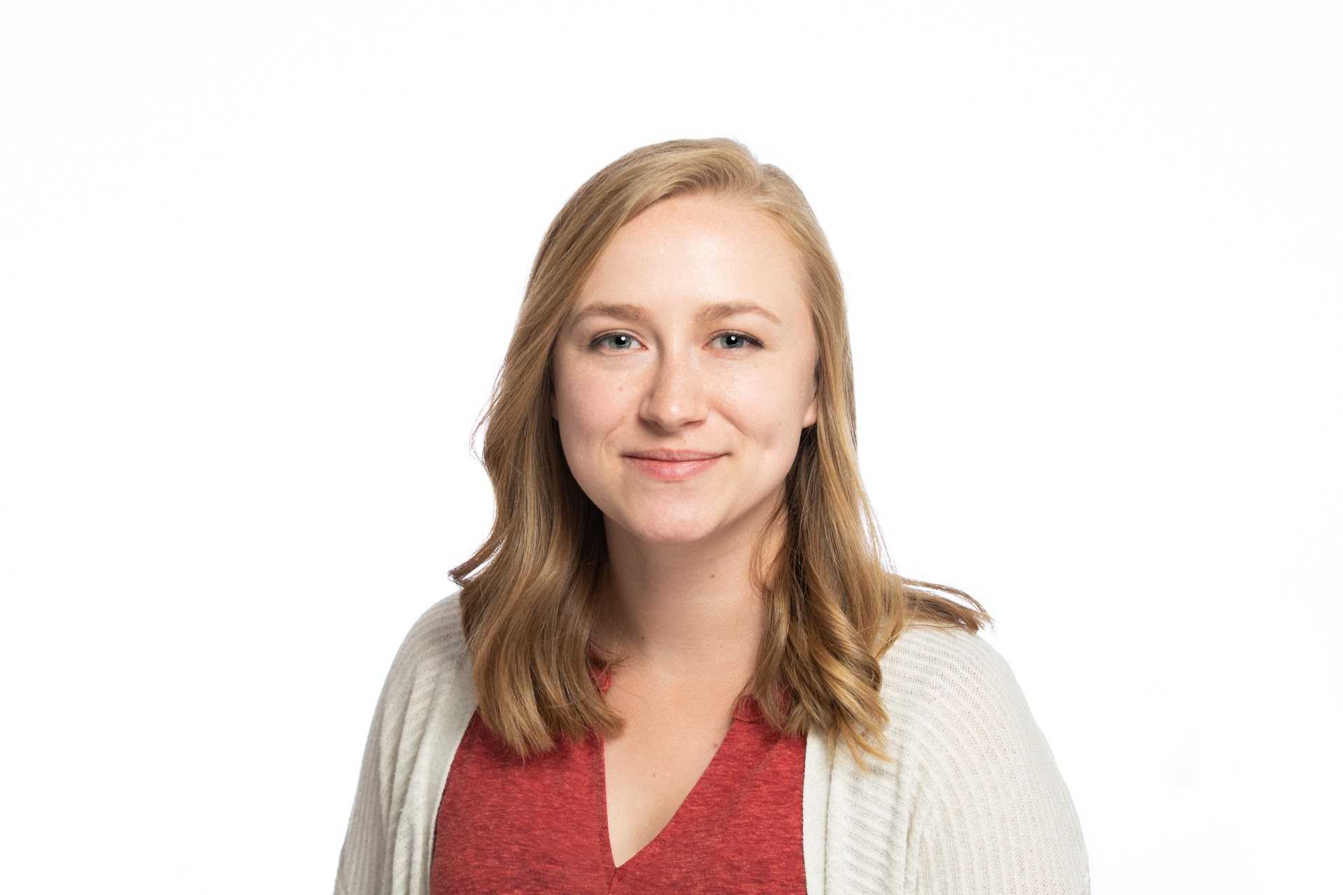 Picture of light skinned woman with blond shoulder length hair